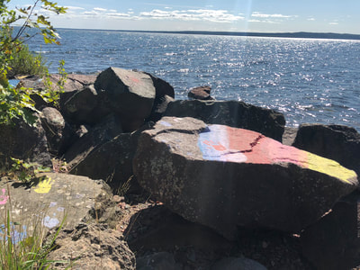 Native Canadian artwork on the rocks at Lake Superior Shoreline at Gros Cap.