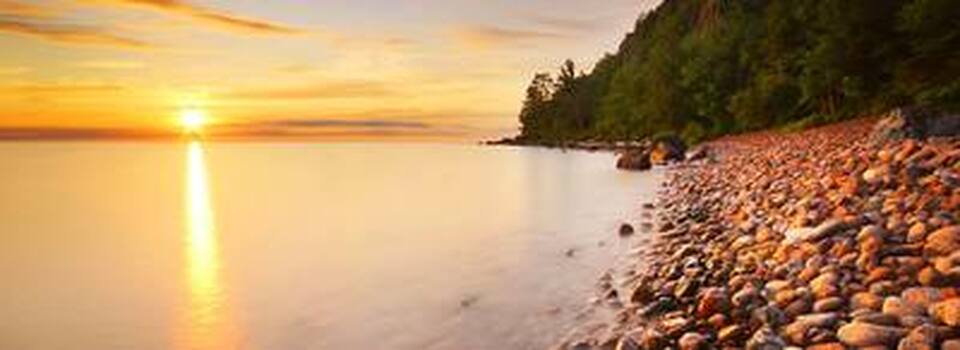 Sunset along Lake Superior shoreline at Gros Cap during summer season.
